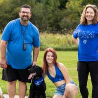 Family walking with dogs